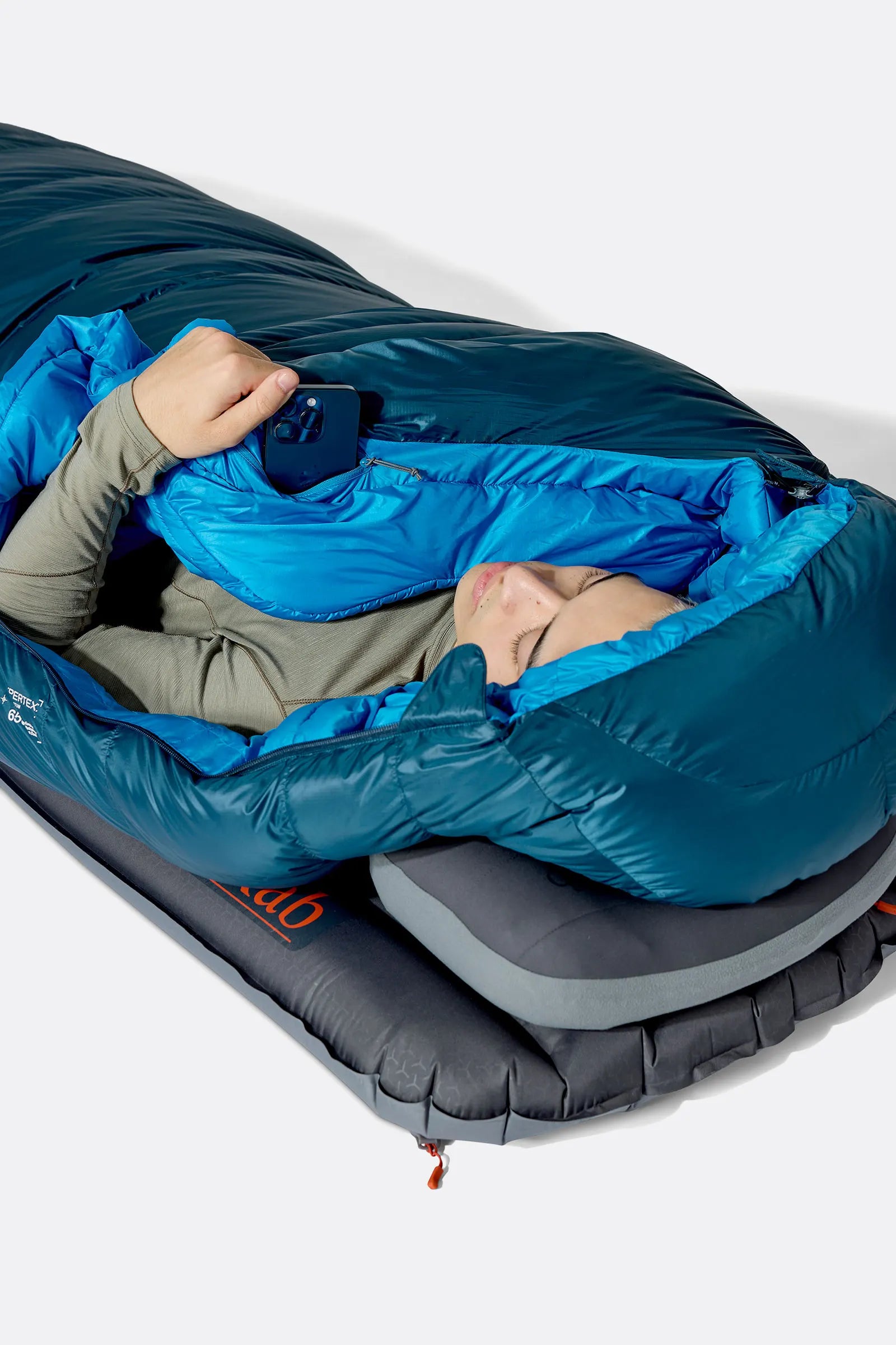 Rab Ascent Down Sleeping Bag (-24°C/-11F) in Tempest Blue/Maya Blue - Model Lying Overhead