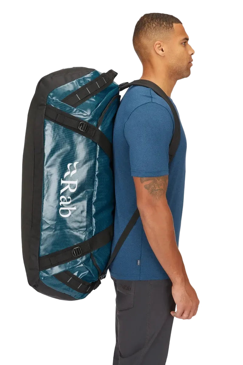 Rab Expedition II 120L Kitbag in Blue - Model Wearing as Backpack Side View