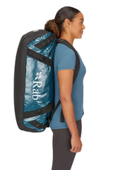 Rab Expedition II 80L Kitbag in Blue - Model Wearing as Backpack Side View