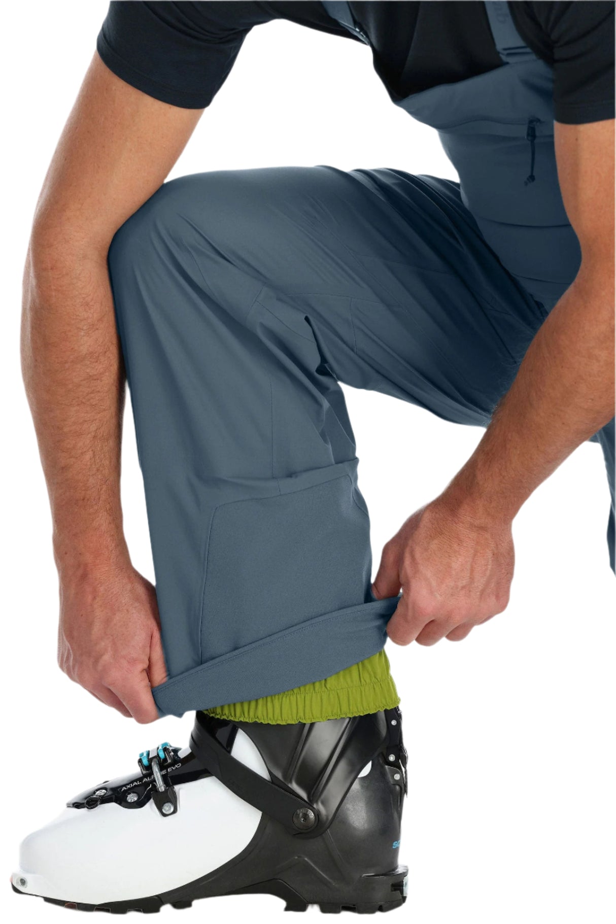 Rab Men's Khroma Kinetic Waterproof Bib Pants in Orion Blue - hem detail, worn