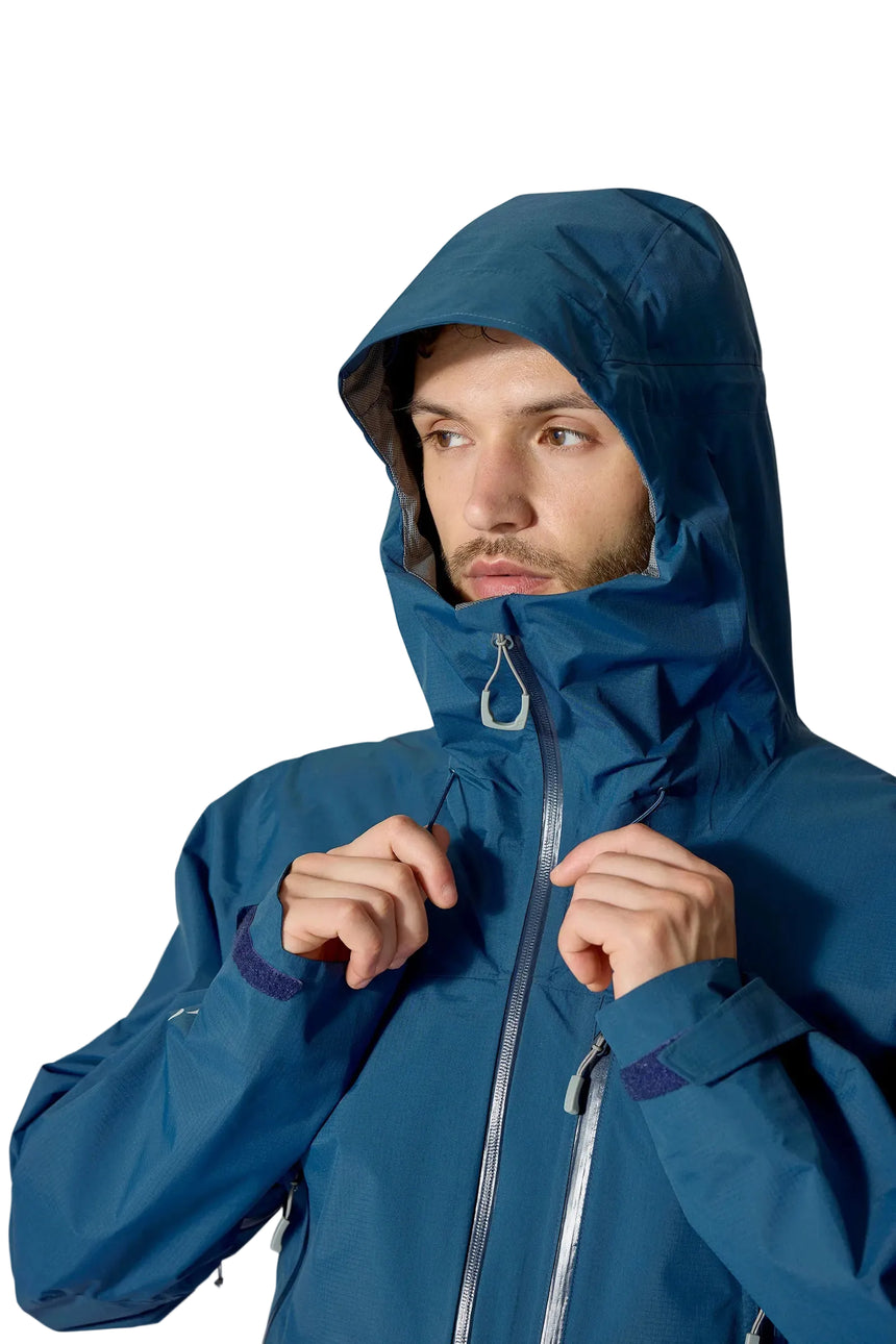 Rab Men's Downpour Mountain Waterproof Jacket in Tempest Blue - hood up, worn, adjusting