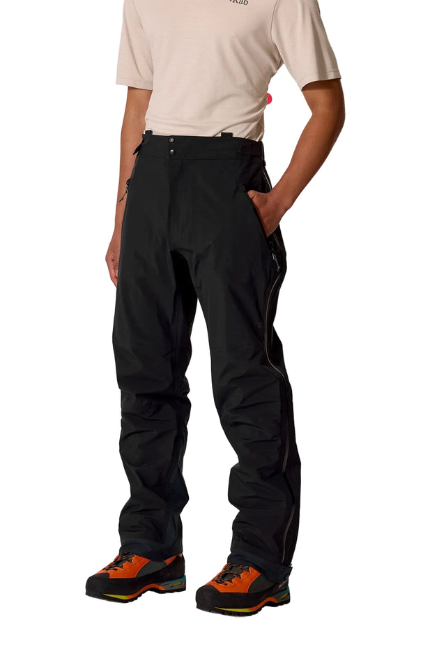Rab Men's Firewall Guide Waterproof Pants in Black - worn front on model