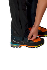 Rab Men's Firewall Guide Waterproof Pants in Black - hem adjustment detail on model