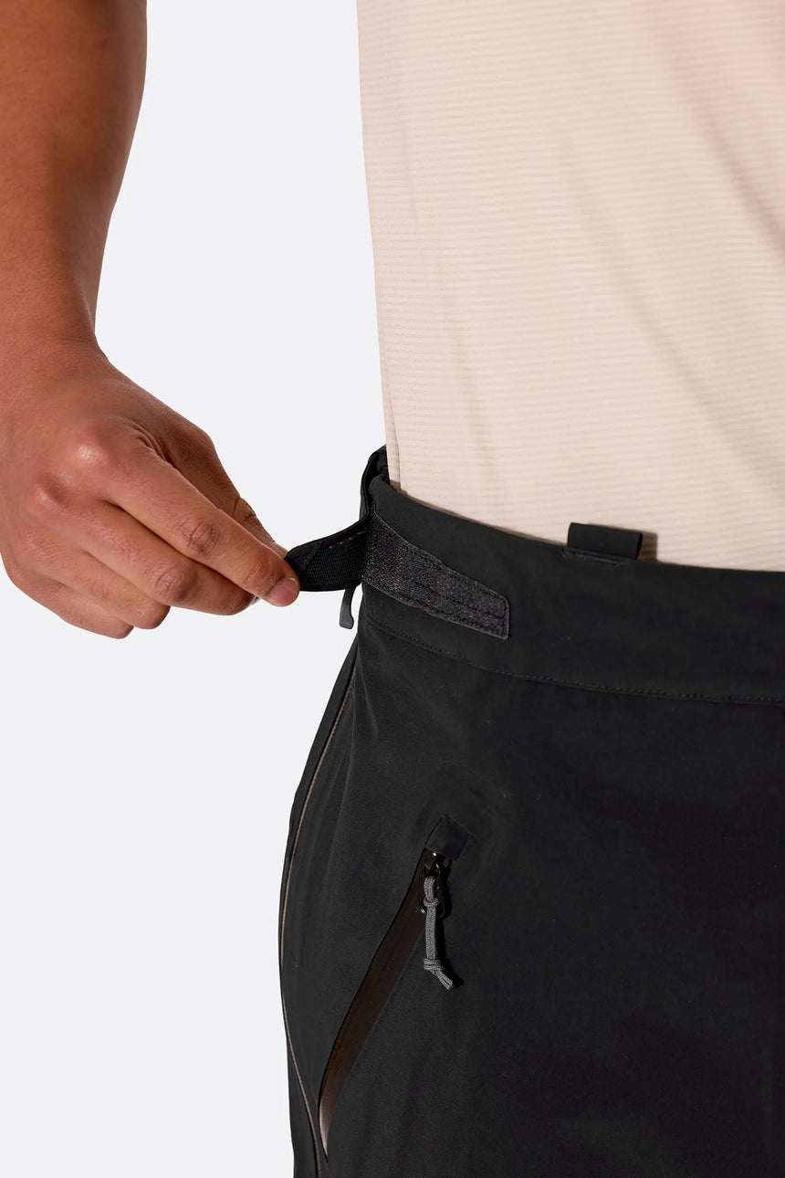 Rab Men's Firewall Guide Waterproof Pants in Black - waist adjustment detail on model