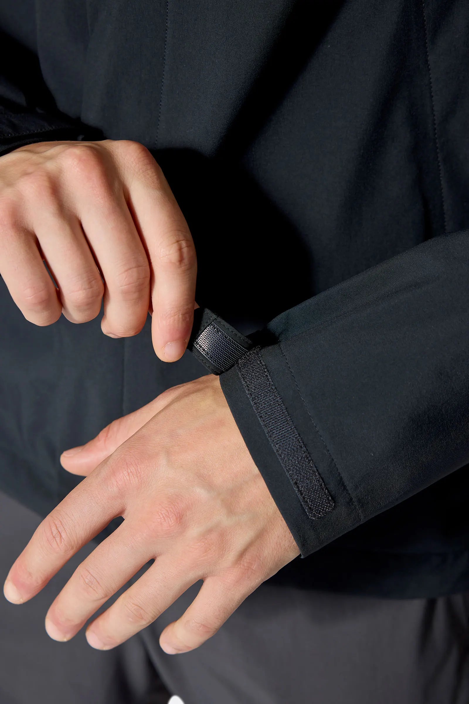 Rab Men's Firewall Waterproof Jacket in Black - cuff detail on model