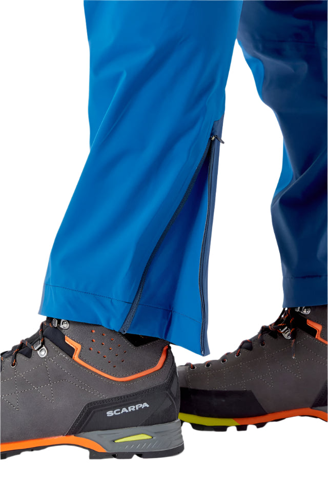 Rab Men's Kinetic Alpine 2.0 Waterproof Pants in Blue (styling reference) - hem gusset detail