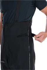 Rab Men's Latok GORE-TEX Pro Bib Pants in Black - side zip detail, worn