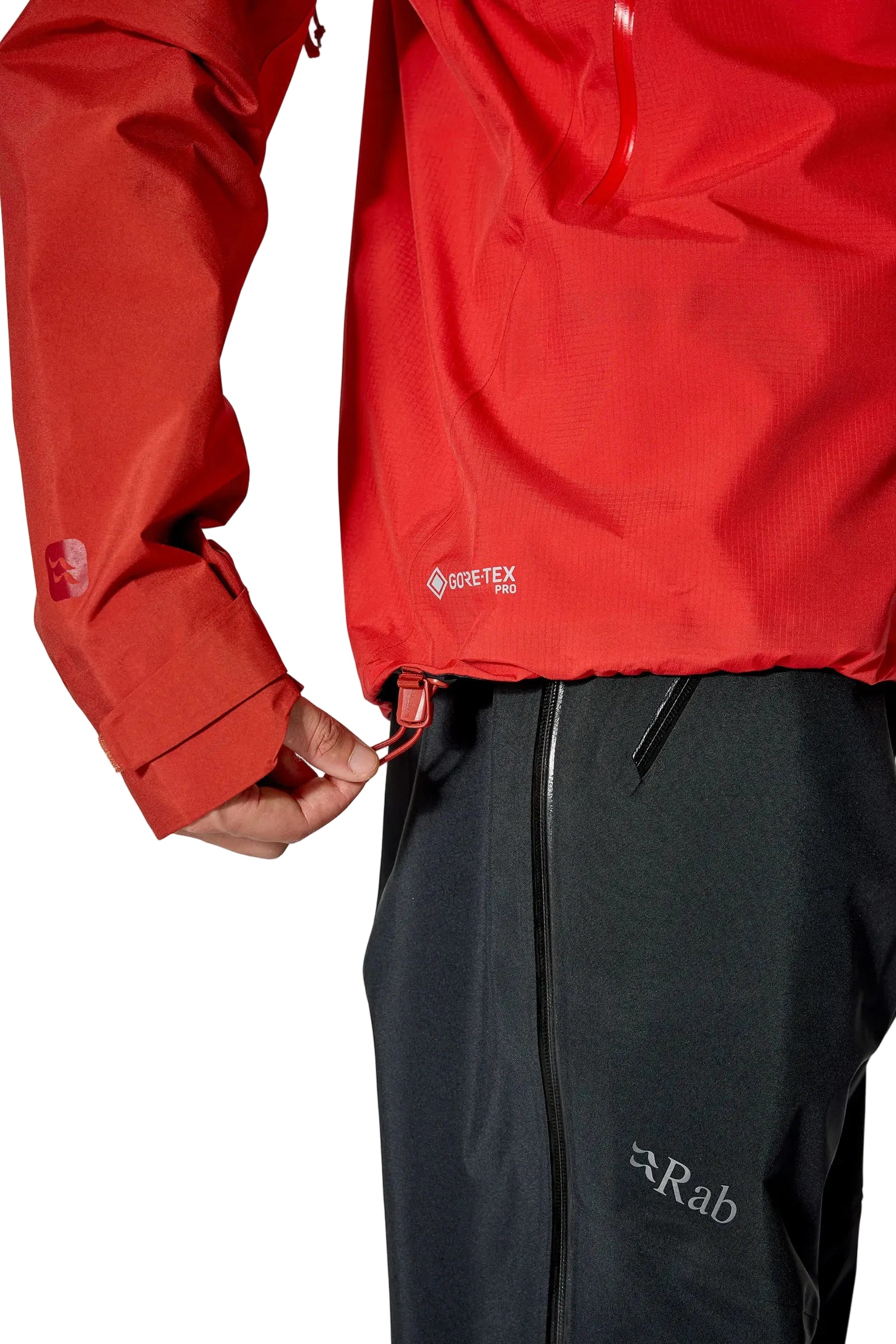 Rab Men's Latok Mountain GORE-TEX Pro Jacket in Tuscan Red/Dark Horizon (styling reference) - hem and cuff detail, worn