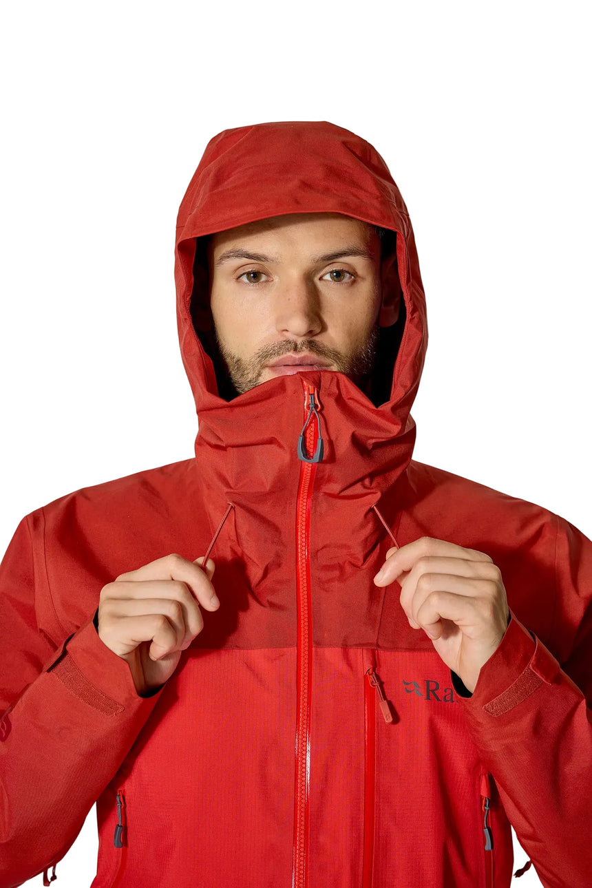 Rab Men's Latok Mountain GORE-TEX Pro Jacket in Tuscan Red/Dark Horizon (styling reference) - worn, hood up, chin guard detail