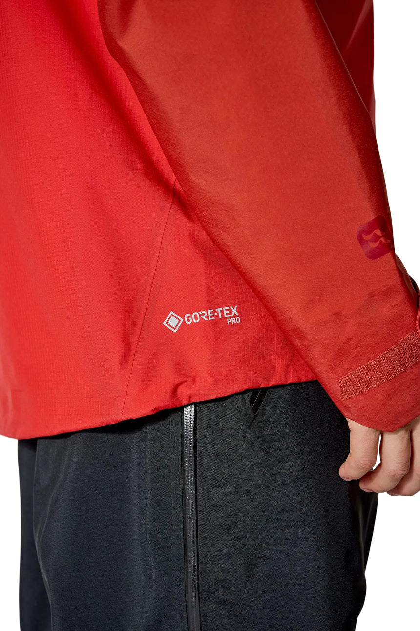 Rab Men's Latok Mountain GORE-TEX Pro Jacket in Tuscan Red/Dark Horizon (styling reference) - side view, worn