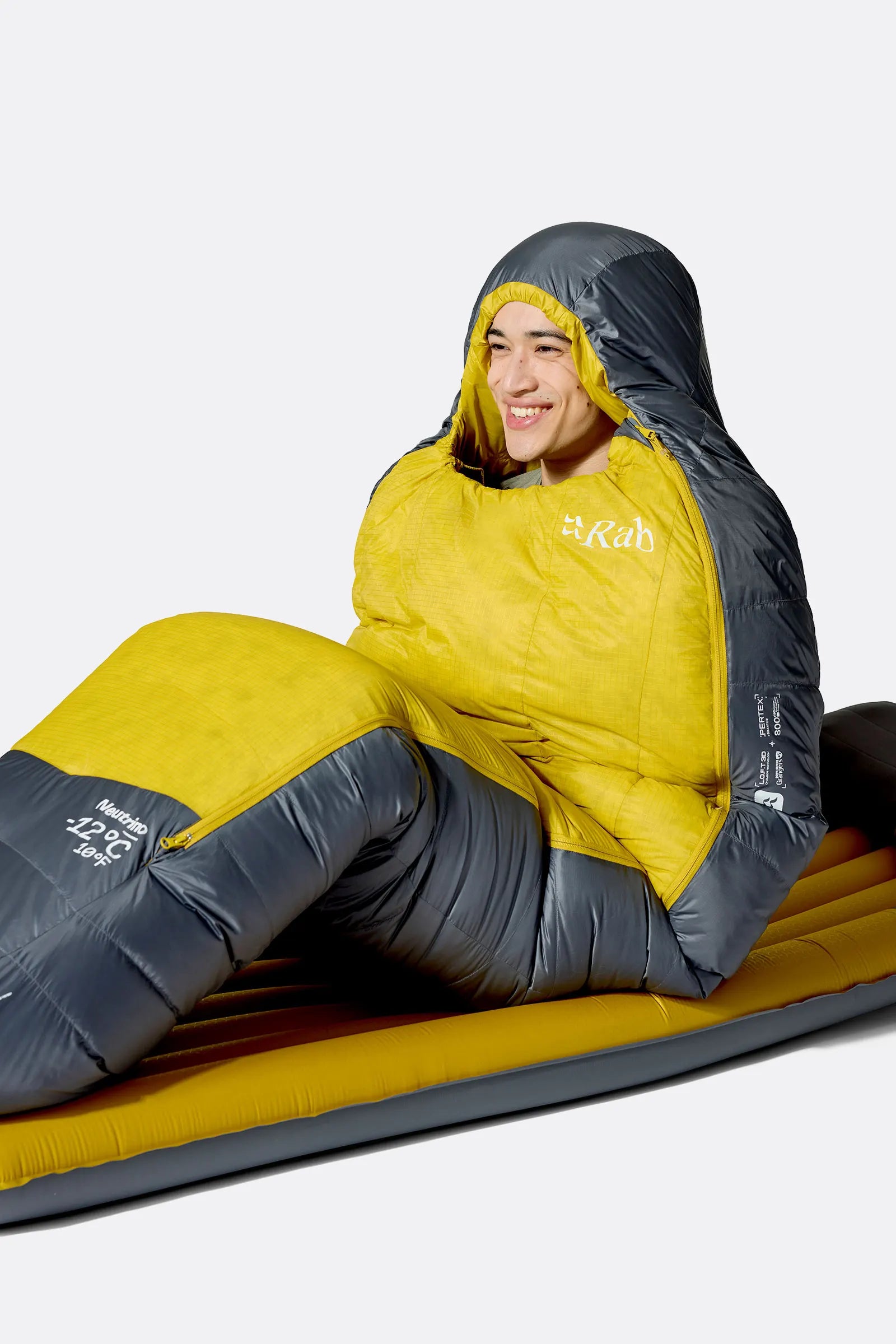 Rab Neutrino Down Sleeping Bag (0°C/32F) in Graphene/Dark Pollen - Model Sitting Up