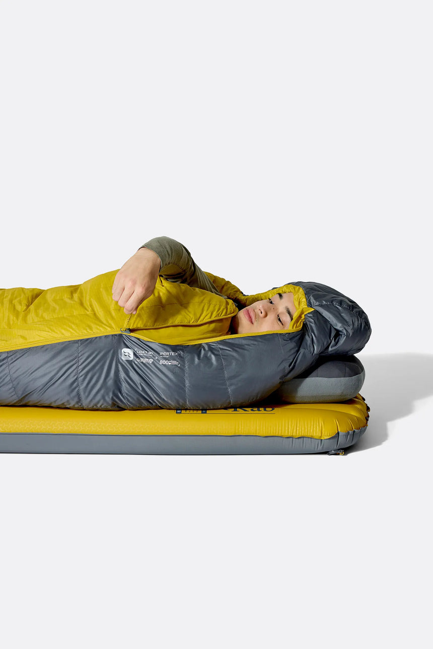 Rab Neutrino Down Sleeping Bag (-18°C/0F) in Graphene/Dark Pollen - Model Lying Wide