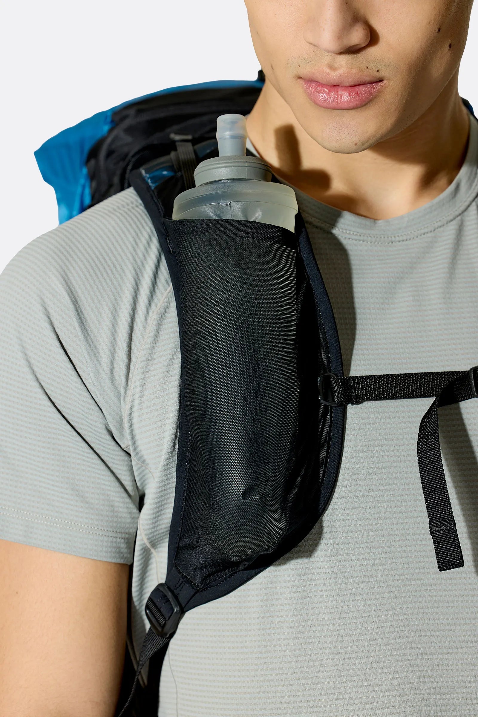Rab Syclon XP 30L Waterproof Pack in Black/Maya Blue - Side View On Model 3