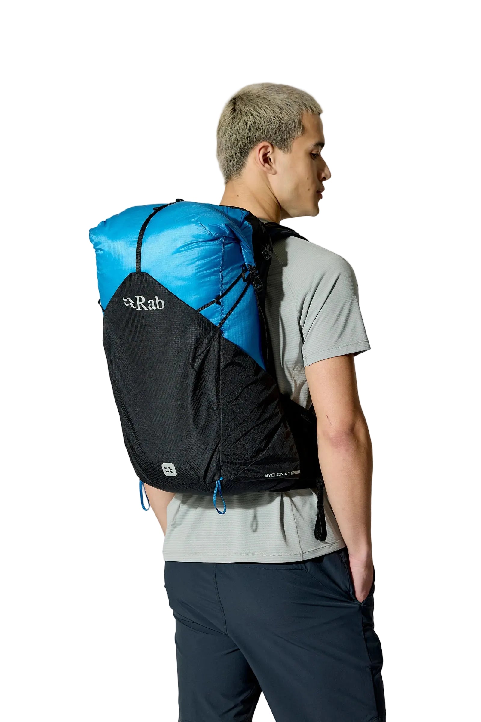 Rab Syclon XP 30L Waterproof Pack in Black/Maya Blue - Side View On Model