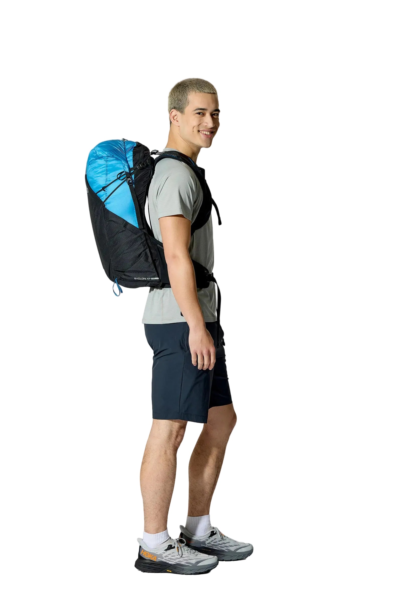 Rab Syclon XP 30L Waterproof Pack in Black/Maya Blue - Three Quarter View On Model 3