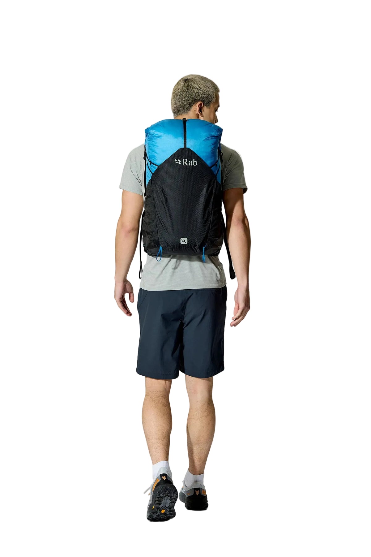 Rab Syclon XP 30L Waterproof Pack in Black/Maya Blue - Three Quarter View On Model 4