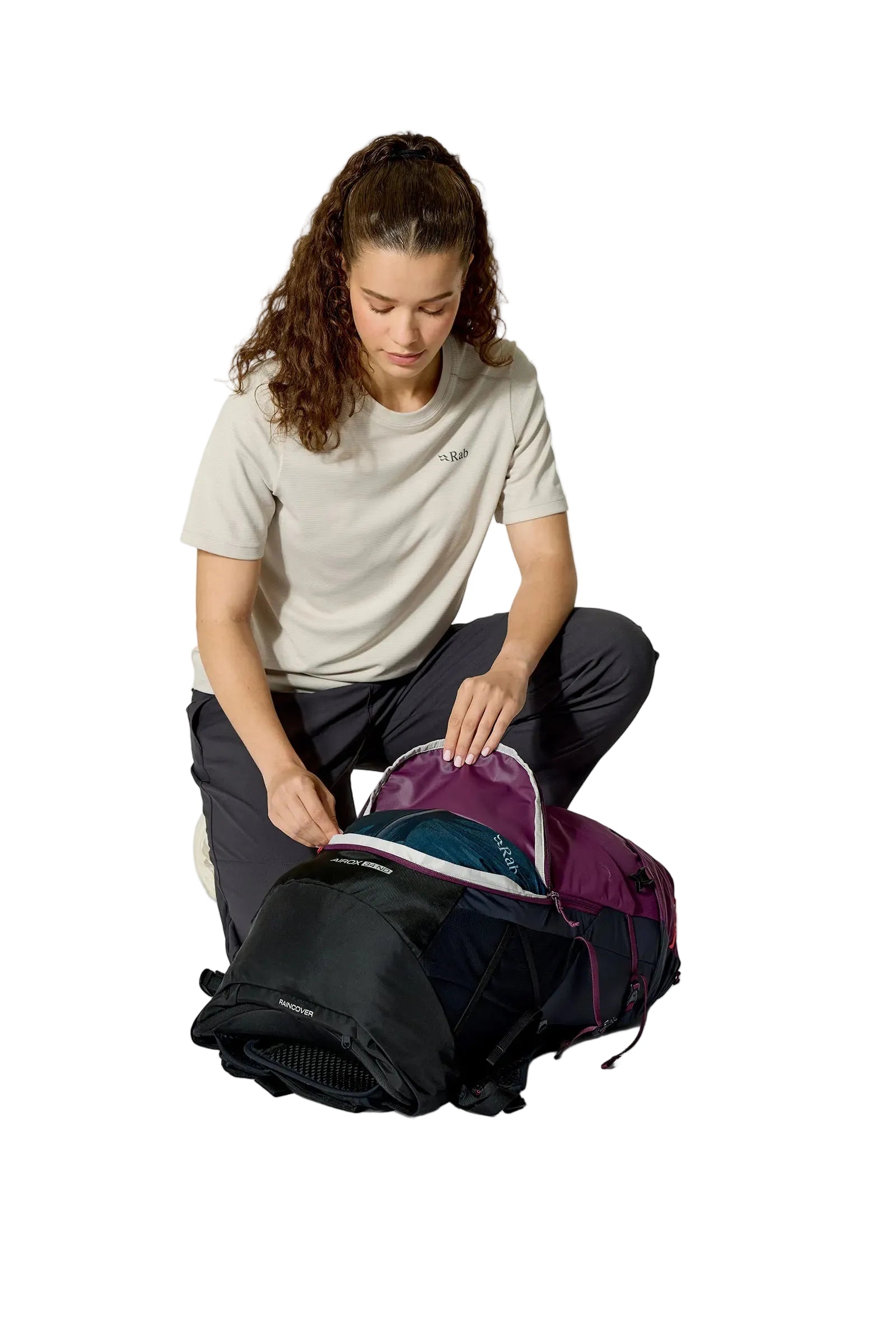 Rab Women's Airox ND 34 Day Pack in Mulberry/Black - Seated View On Model