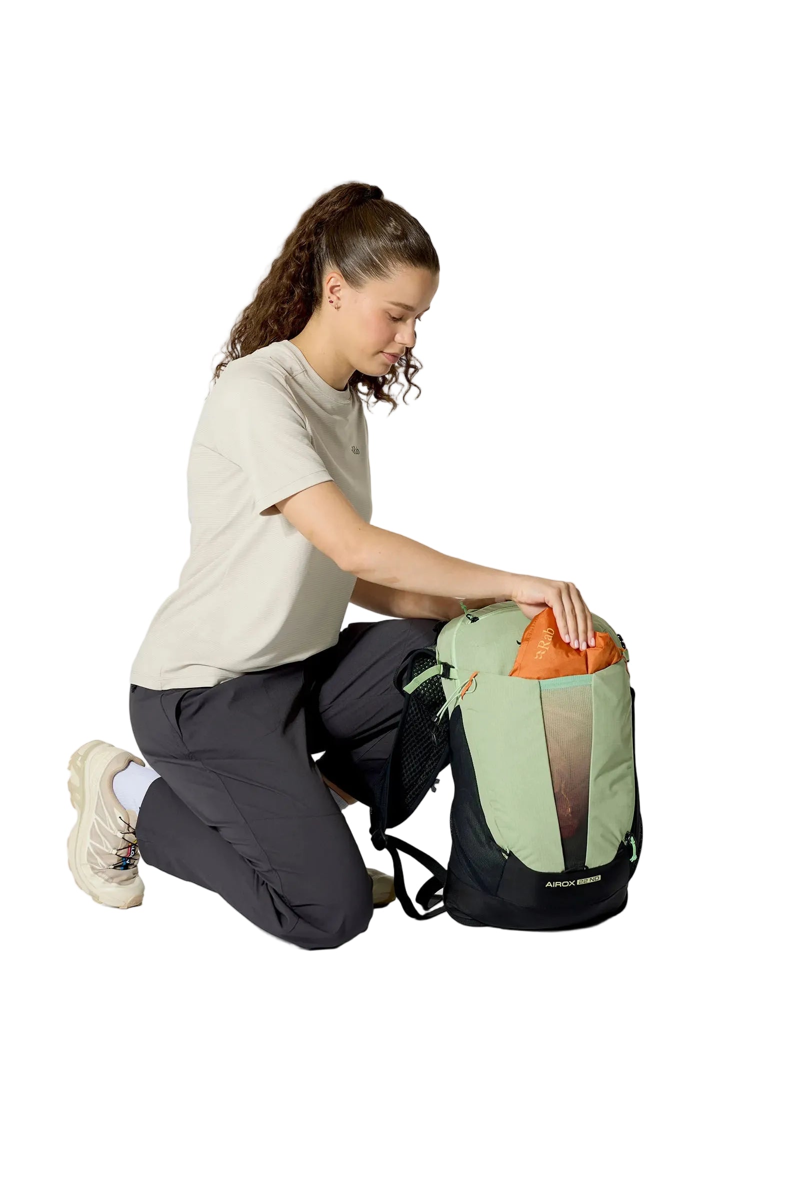 Rab Women's Airox ND22L Day Pack in Fig Green/Black - On Model Kneeling View