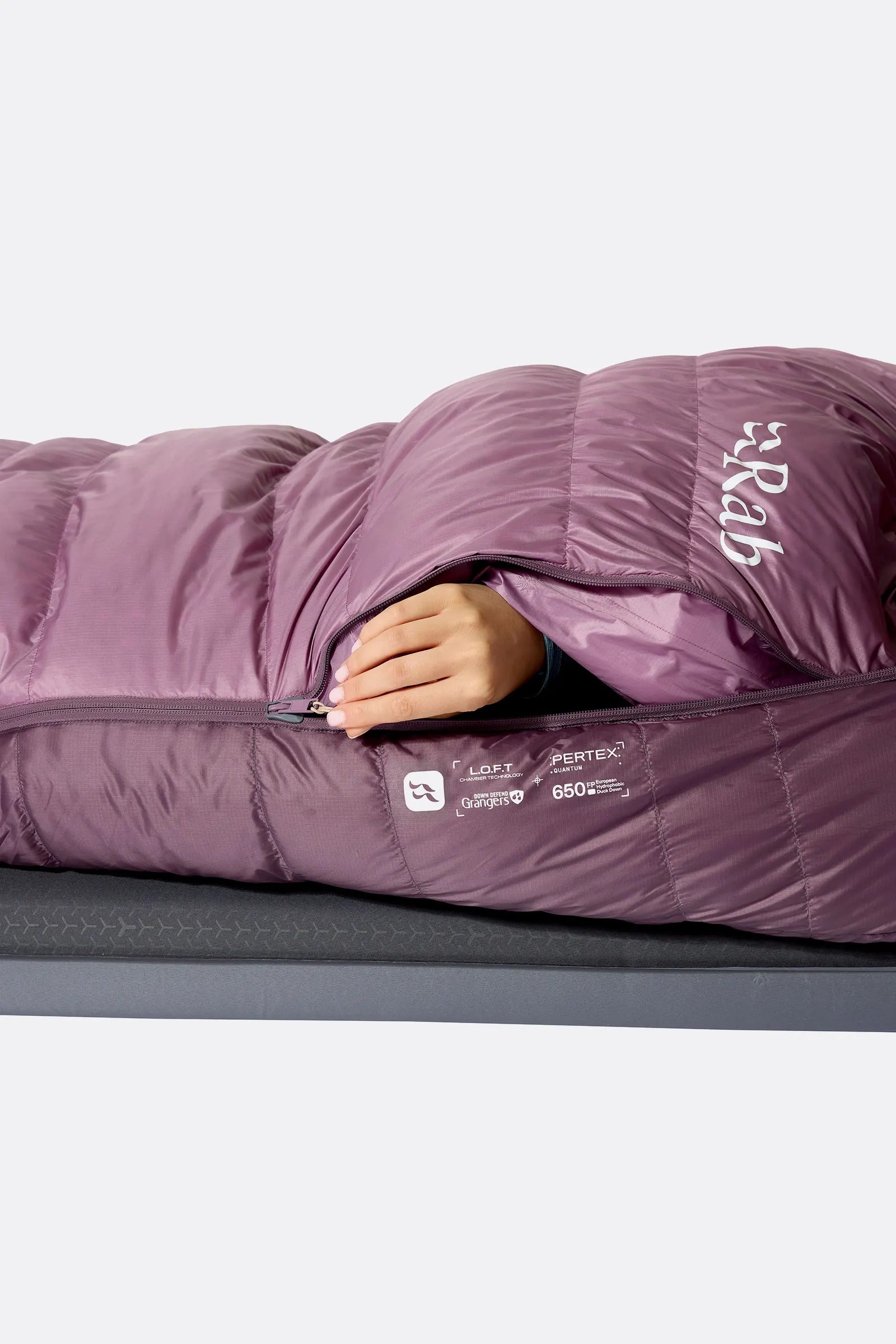 Rab Women's Alpine Down Sleeping Bag (-6°C/21F) in Iris/Dark Iris - Model Lying Wrapped