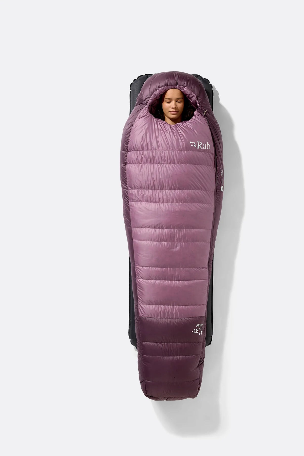Rab Women's Alpine Down Sleeping Bag (-6°C/21F) in Iris/Dark Iris - Model Seated Close