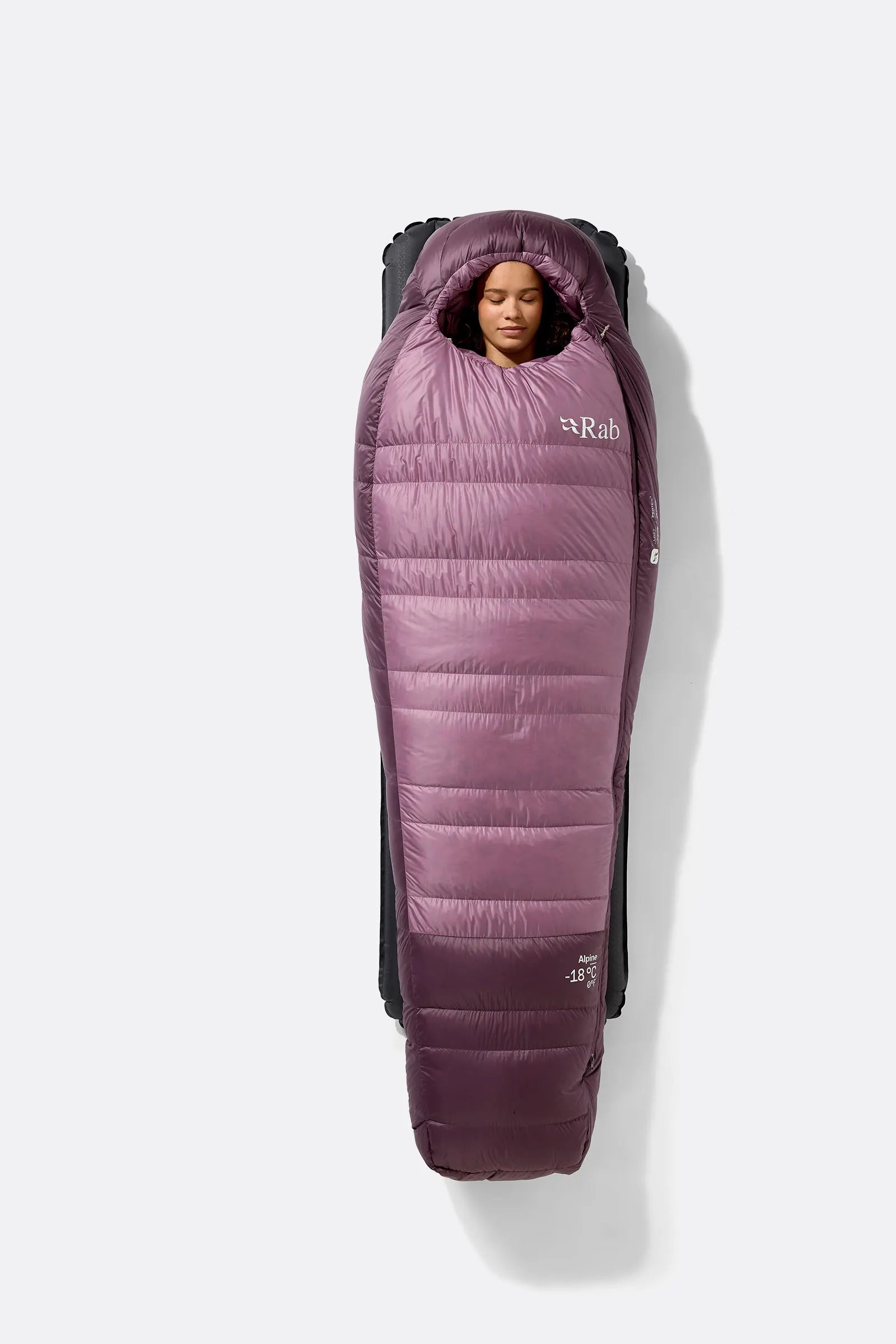 Rab Women's Alpine Down Sleeping Bag (-6°C/21F) in Iris/Dark Iris - Model Seated Close