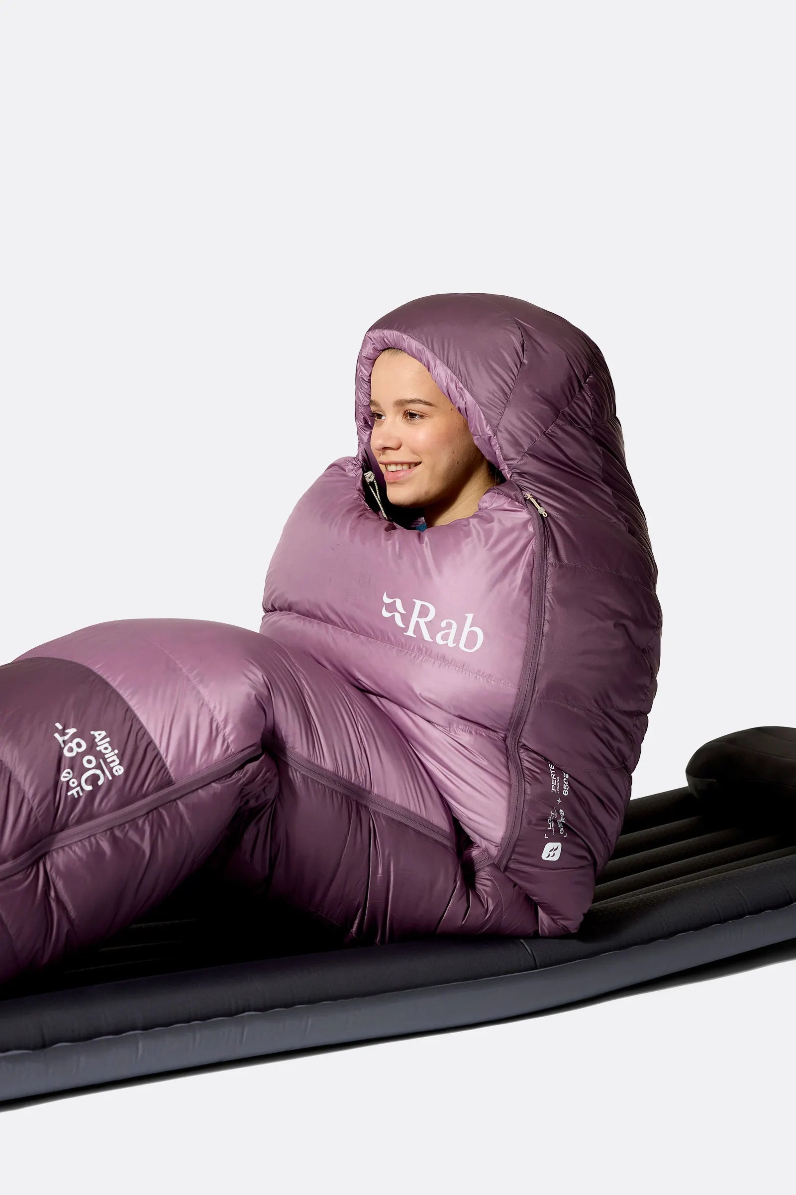 Rab Women's Alpine Down Sleeping Bag (-6°C/21F) in Iris/Dark Iris - Model Seated Hood