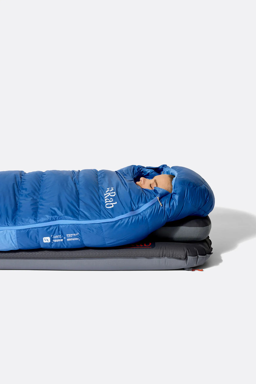 Rab Women's Ascent Down Sleeping Bag (-18°C/0F) in Dark BlueBird/BlueBird - Model Lying Wide