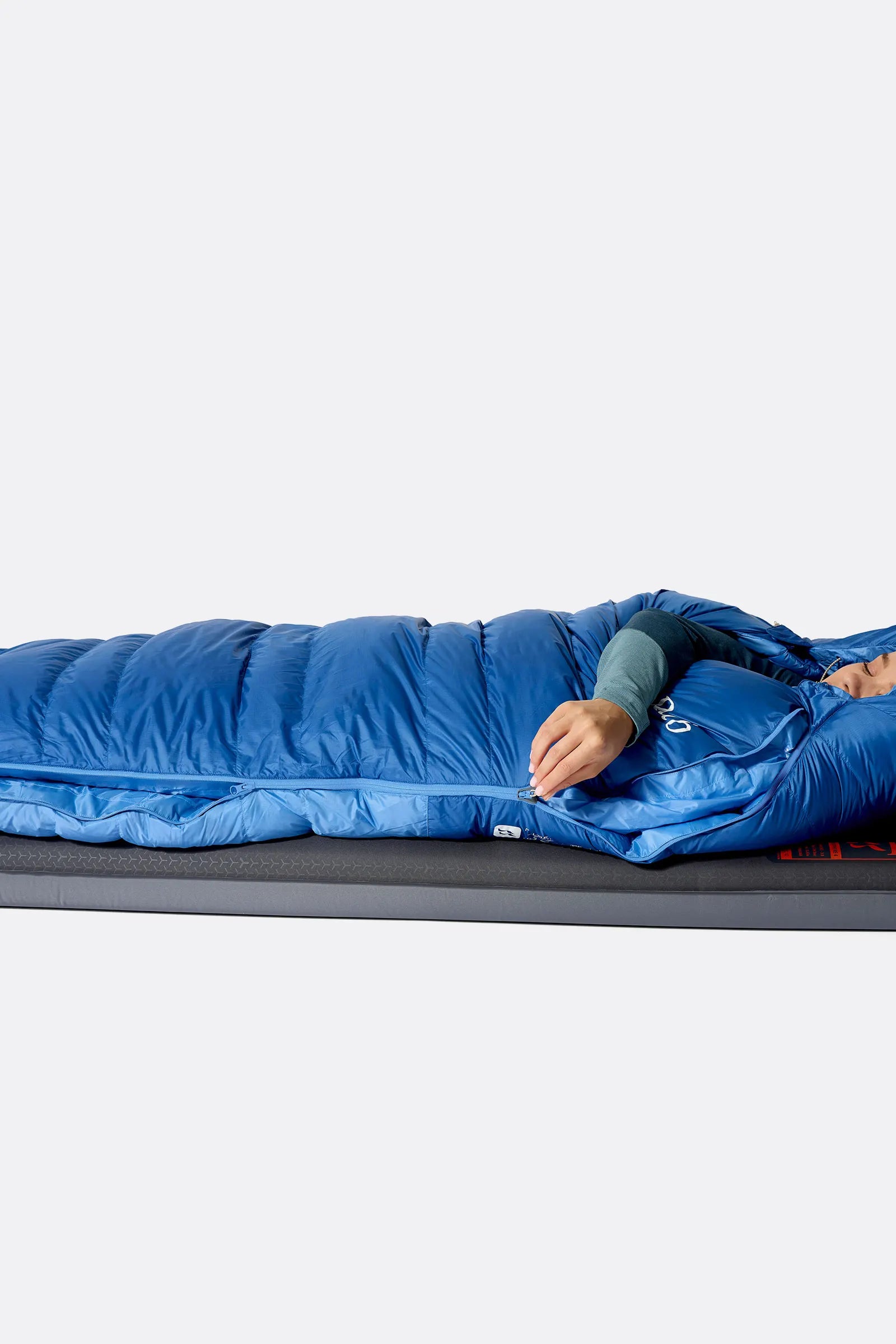 Rab Women's Ascent Down Sleeping Bag (-18°C/0F) in Dark BlueBird/BlueBird - Model Seated Hood