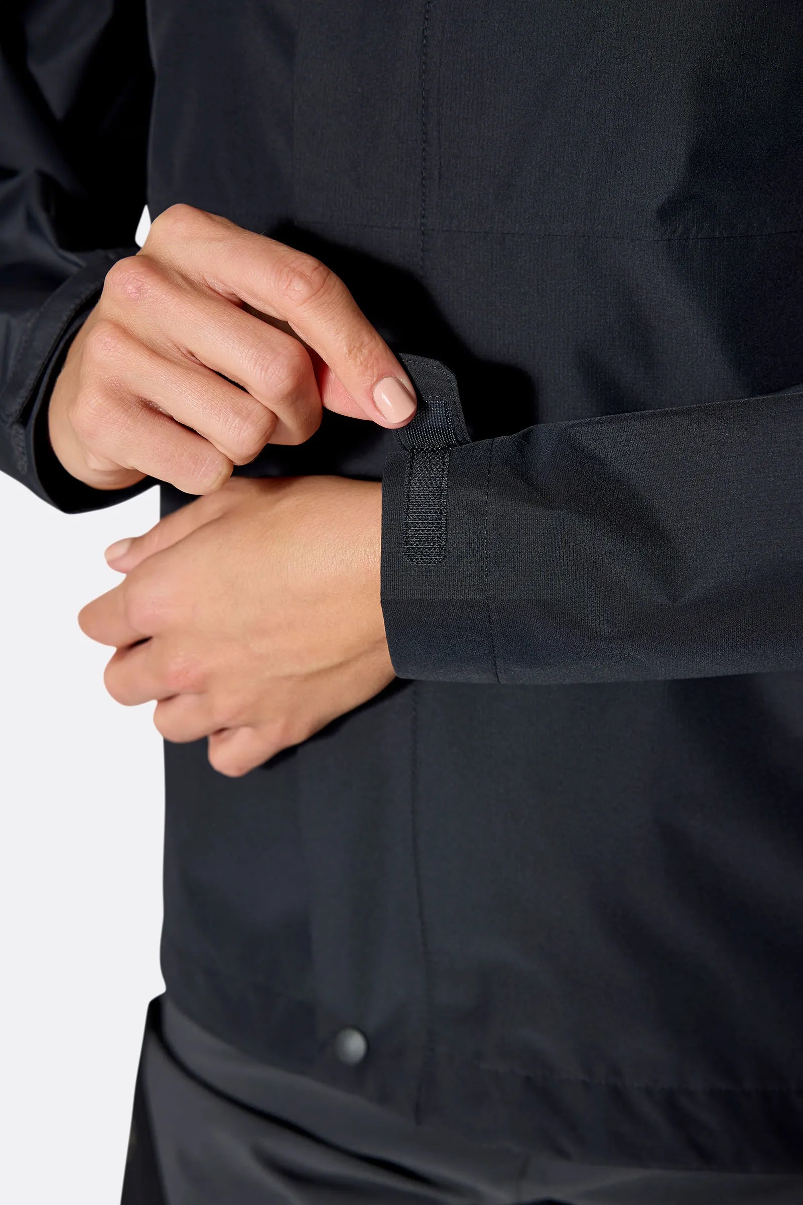 Rab Women's Downpour Eco Jacket in Black (styling reference) - cuff detail, worn
