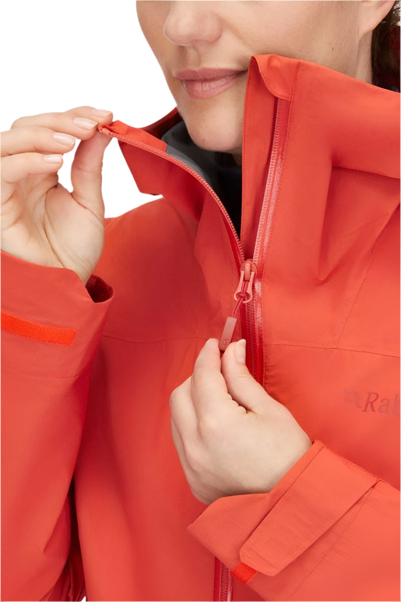 Rab Women's Downpour Light Waterproof Jacket in Red Grapefruit - chin guard detail, worn