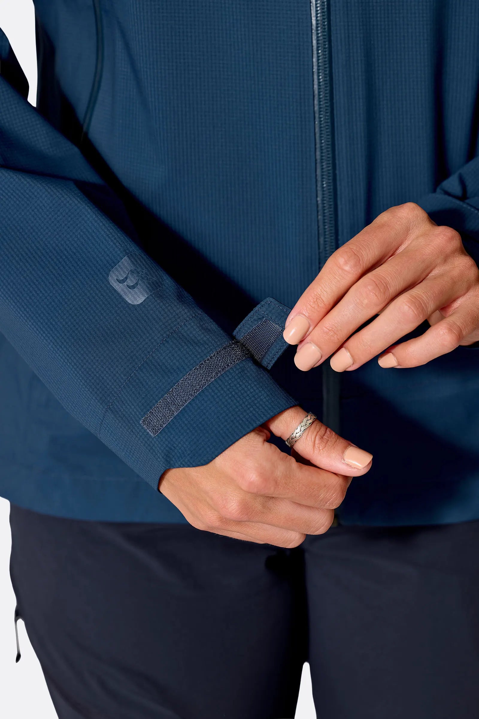 Rab Women's Firewall Light Waterproof Jacket in Tempest Blue - cuff detail, worn
