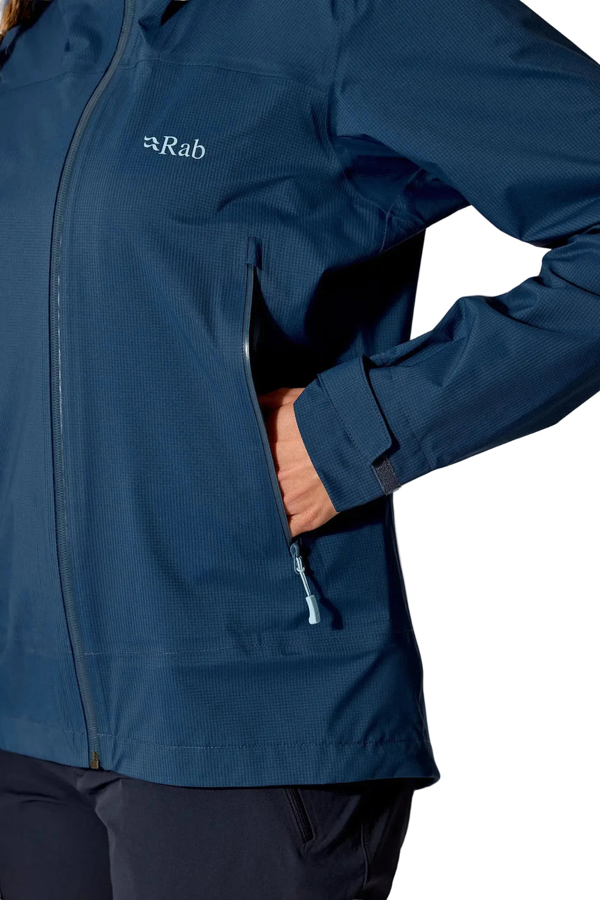 Rab Women's Firewall Light Waterproof Jacket in Tempest Blue - hand pocket detail, worn