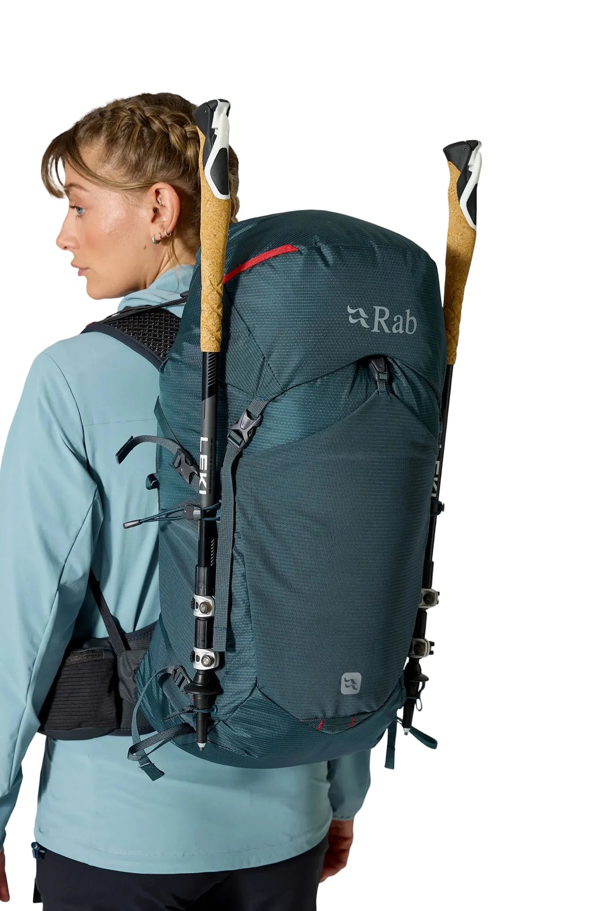Rab Women's Protium ND33L Day Pack in Orion Blue - On Model Side View with Walking Pole