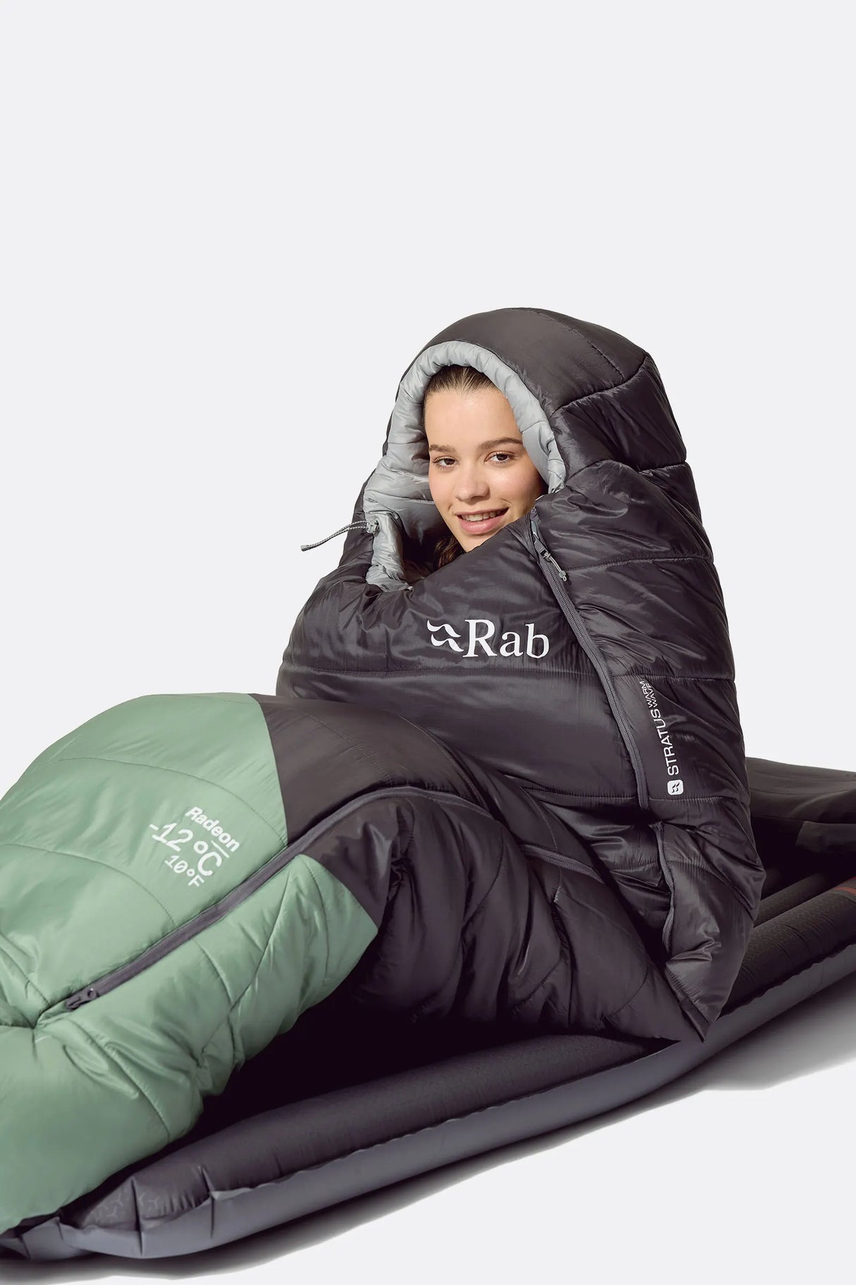 Rab Women's Radeon Synthetic Sleeping Bag (0°C/32F) in Dark Fig Green/Graphene - worn, sitting up