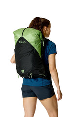 Rab Women's Syclon XP ND 38L Waterproof Pack in Black/Dark Fig Green - Back View On Model 3