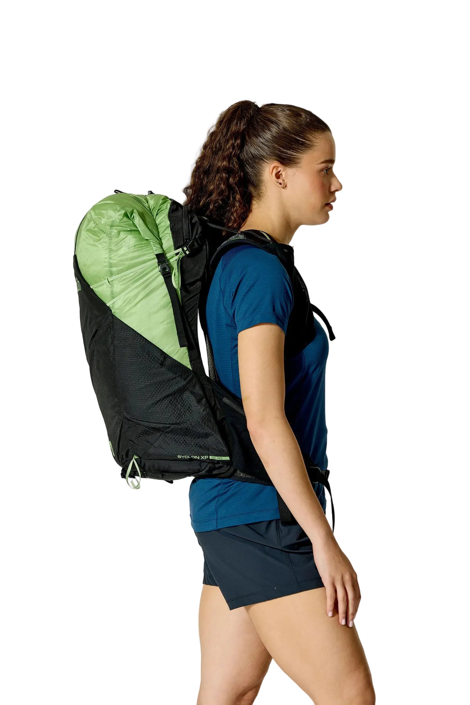 Rab Women's Syclon XP ND 38L Waterproof Pack in Black/Dark Fig Green - Side View On Model