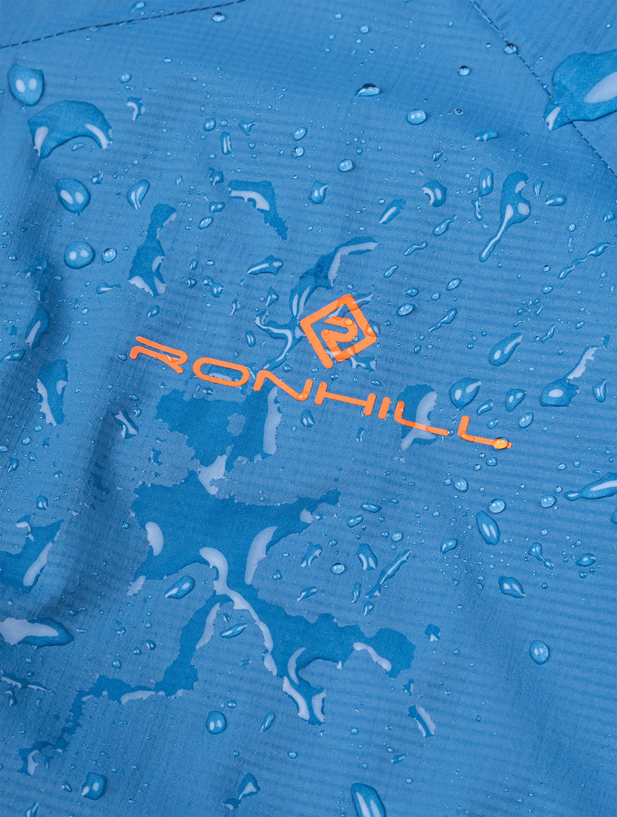 Ronhill Men's Tech Storm Jacket in Glacier/Ronhill Red - water-resistance detail