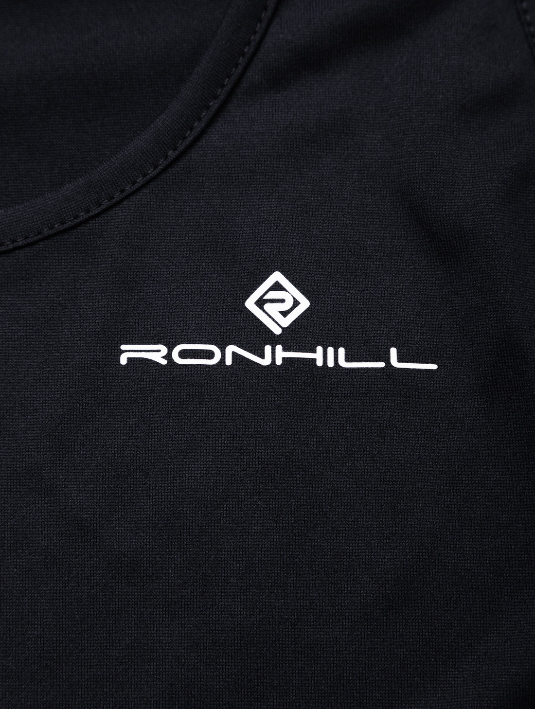 Ronhill Women's Core S/S Tee in Black/Bright White - brand logo detail
