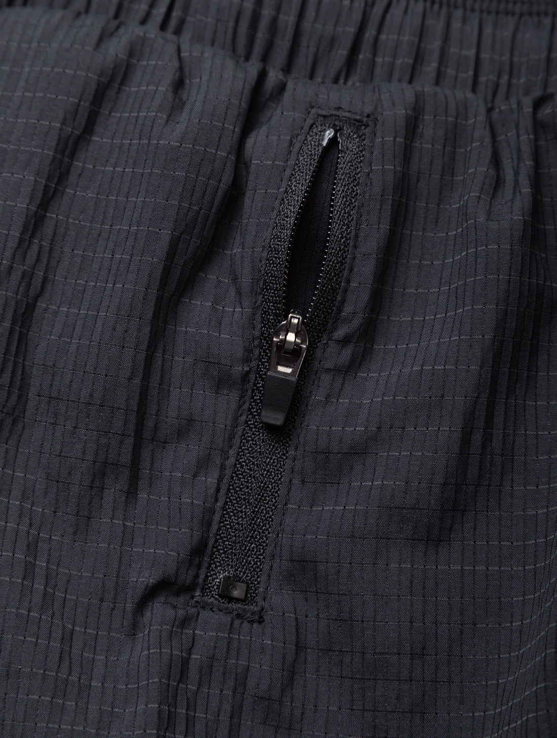 Ronhill Women's Tech Race Short in All Black - side zip pocket detail