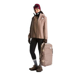 The North Face Base Camp Voyager Duffel 32L in Garnet/Timeless Taupe - worn, front, full body