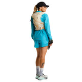 The North Face Sunriser Run Vest 8 in Desert Stone/Rust Orange - worn, back three-quarter