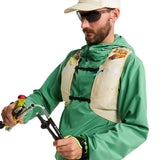 The North Face Sunriser Run Vest 8 in Desert Stone/Rust Orange - worn, front, full body with trekking poles