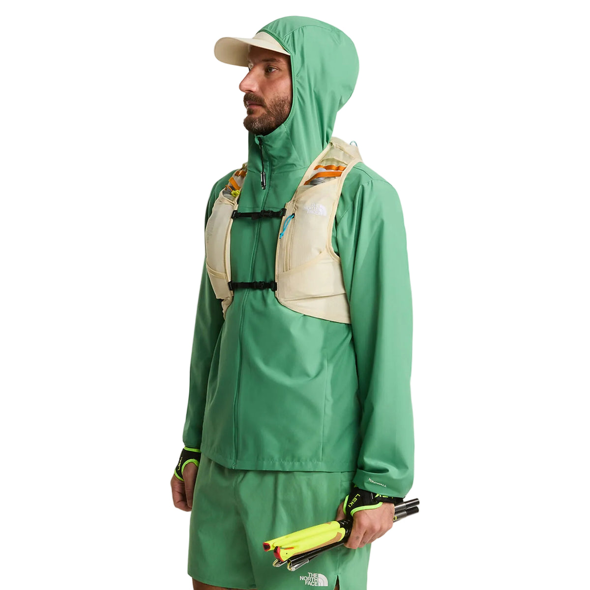The North Face Sunriser Run Vest 8 in Desert Stone/Rust Orange - worn, hood up, side profile