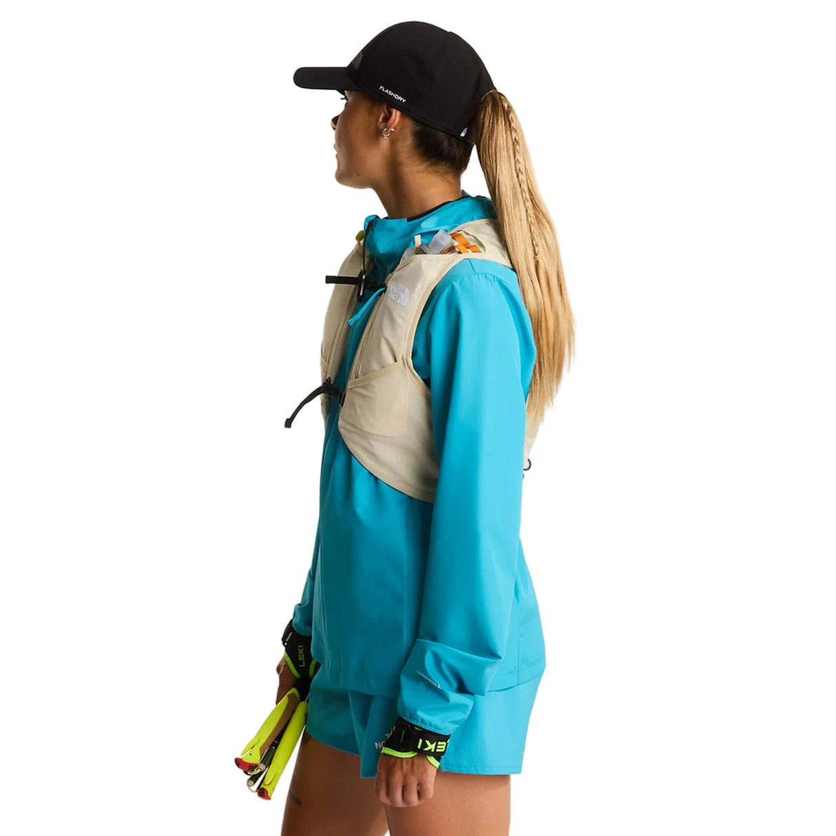 The North Face Sunriser Run Vest 8 in Desert Stone/Rust Orange - worn, side profile
