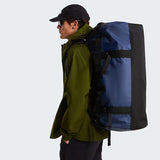 The North Face Base Camp Duffel Large Summit Navy/TNF Black - side view with detachable ergonomic shoulder straps and padded handles