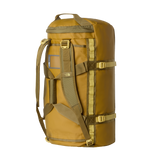 The North Face Base Camp Duffel Medium Golden Tan/Cedar - lifestyle shot showing versatile backpack and duffel carry options