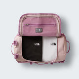 The North Face Base Camp Duffel Small 50L Metal Pink/Hushed Lavender - top view showing D-zip opening and compression straps