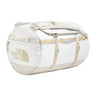 The North Face Base Camp Duffel Small 50L White Ash/Calac - lifestyle shot showing versatile backpack and duffel carry options