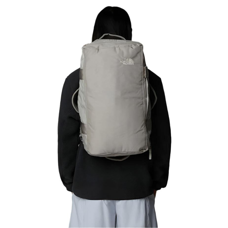 The North Face Base Camp Voyager 32L Duffel Soapstone/Stone Slab - side view with padded shoulder straps and grab handles