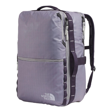 The North Face Base Camp Voyager Daypack 35L Large being used for travel, demonstrating luggage pass-through and versatile carry options